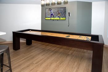 Gaming area with shuffleboard table